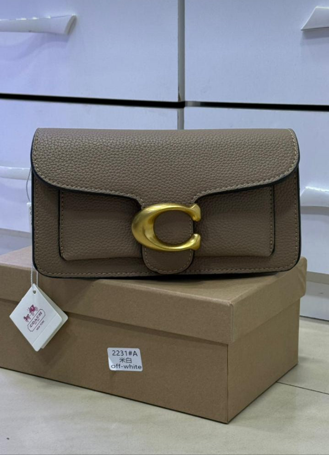 Co@ch
pochette Tabby