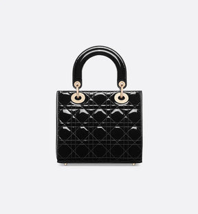 Sac Ladÿ Diôr Small
de veau Cannage verni noir
