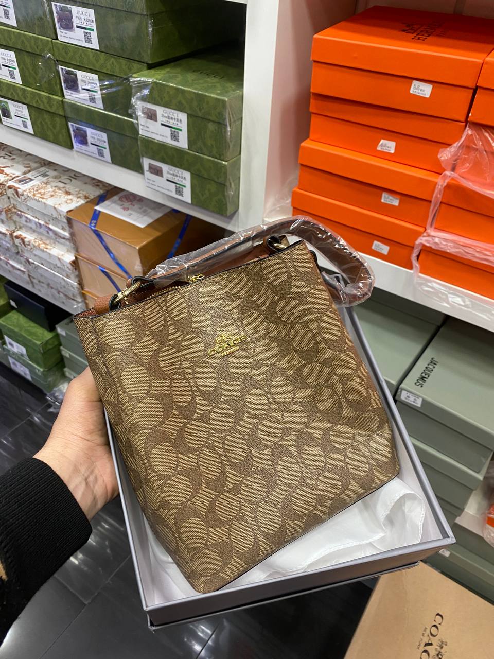 Co@ch Sac seau Sophie en toile signature