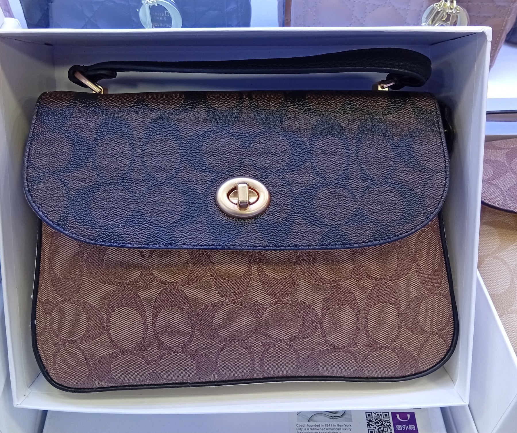 Sac à main Co@ch Marlie à poignée supérieure en toile à motif signature.
