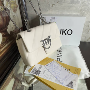 PÏNKÔ 
sac porté épaule Love à design matelassé